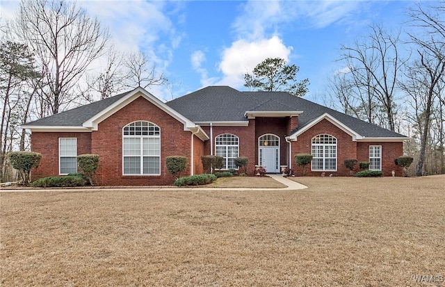 ranch-style home with a front yard