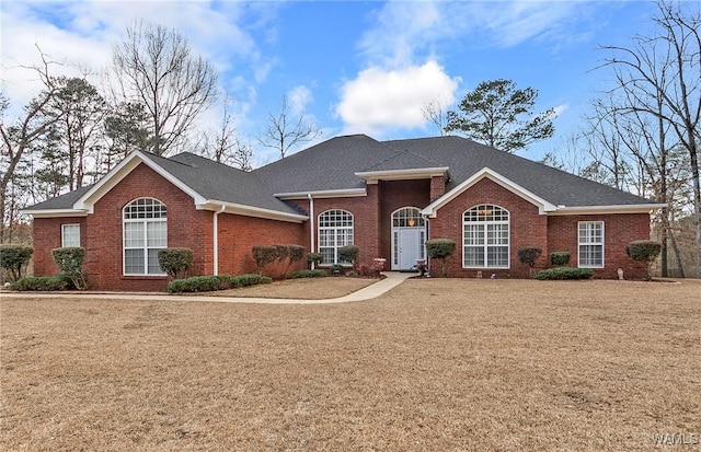 single story home with a front yard