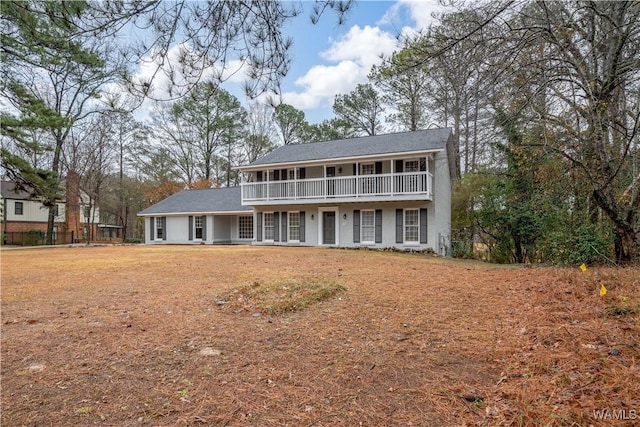 view of front of property with a balcony