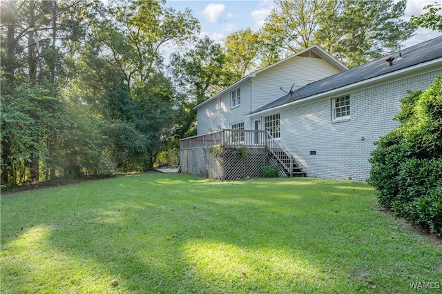 view of yard featuring a deck