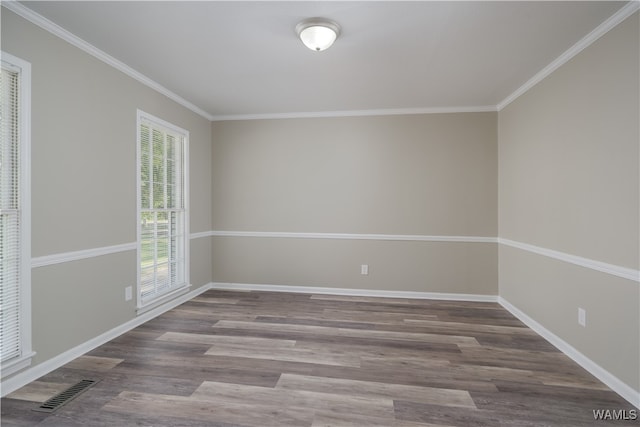 unfurnished room with hardwood / wood-style flooring and ornamental molding