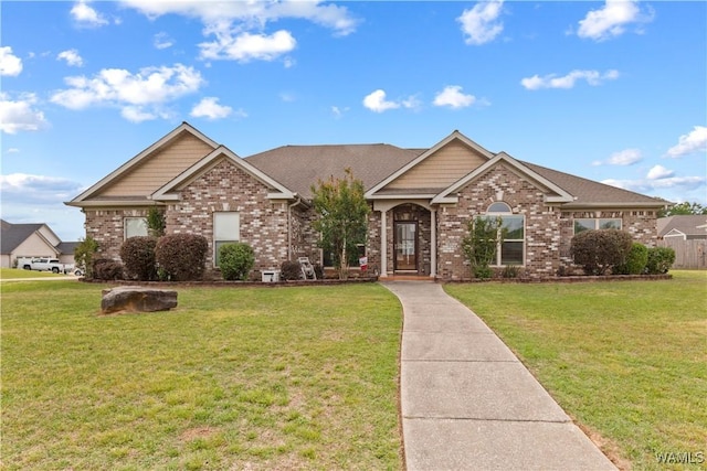 view of front of property featuring brick siding and a front lawn