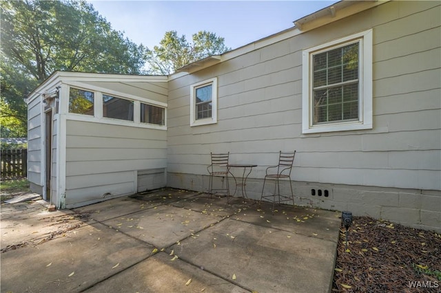 view of side of home featuring a patio