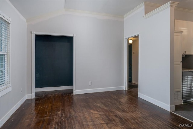 unfurnished room with ornamental molding and dark hardwood / wood-style floors