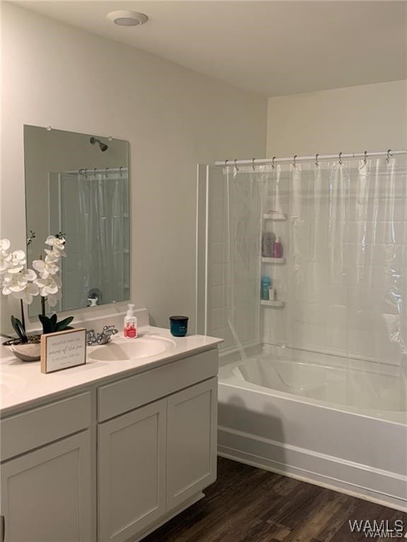 7106 Dowery Dell Way, Northport, AL 35473 - bathroom with shower / bath combo with shower curtain, wood finished floors, and vanity