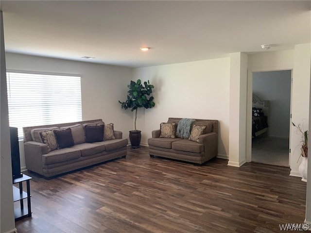7106 Dowery Dell Way, Northport, AL 35473 - living room featuring baseboards and dark wood-type flooring