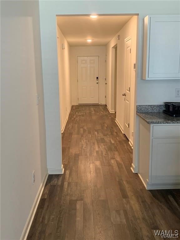 7106 Dowery Dell Way, Northport, AL 35473 - corridor featuring baseboards and dark wood-style floors