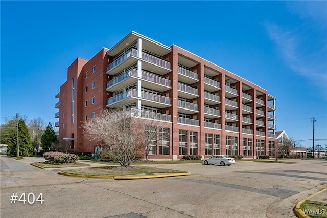 1018 Hackberry Ln Unit 404, Tuscaloosa, AL 35401 - view of apartment building / complex with uncovered parking