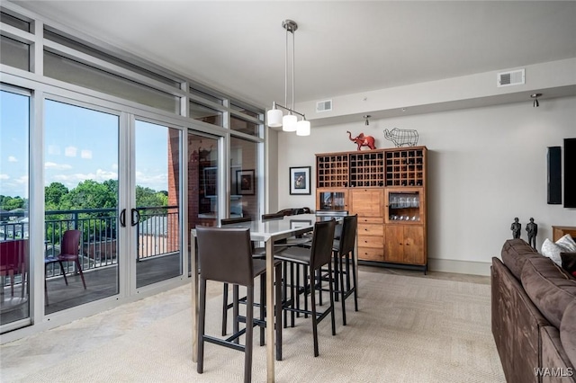 1018 Hackberry Ln Unit 404, Tuscaloosa, AL 35401 - dining area with light carpet