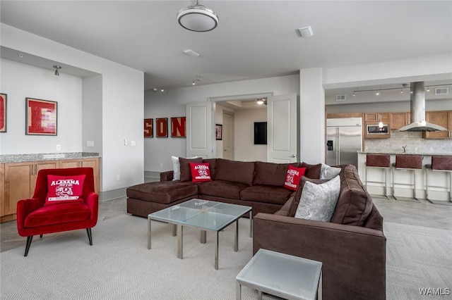 1018 Hackberry Ln Unit 404, Tuscaloosa, AL 35401 - living area with light colored carpet and rail lighting