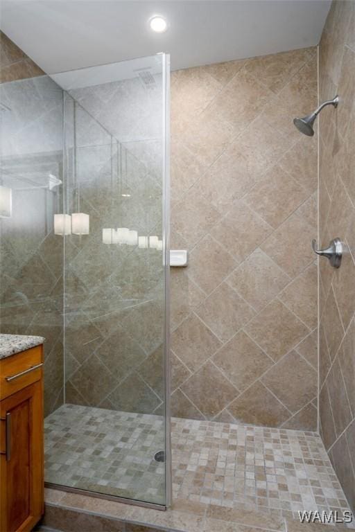 1018 Hackberry Ln Unit 404, Tuscaloosa, AL 35401 - bathroom featuring a stall shower, vanity, and recessed lighting