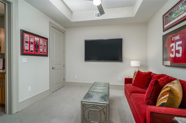 1018 Hackberry Ln Unit 404, Tuscaloosa, AL 35401 - carpeted living area featuring a tray ceiling and baseboards