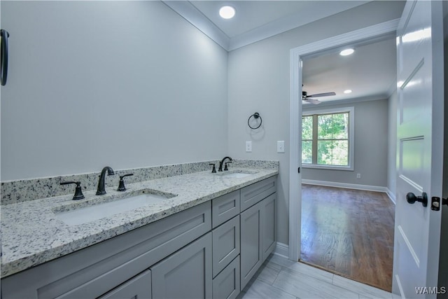 bathroom featuring vanity, ceiling fan, wood-type flooring, and crown molding