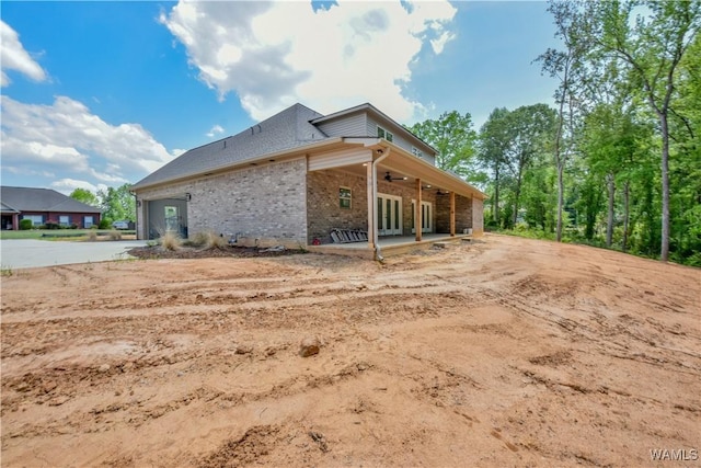 view of property exterior featuring a patio and ceiling fan