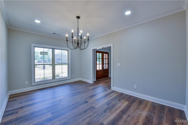spare room with french doors, dark hardwood / wood-style floors, an inviting chandelier, and ornamental molding