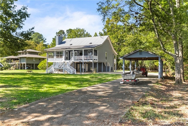 rear view of house with a yard