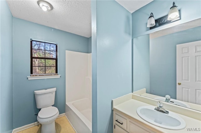 full bathroom with vanity, toilet, tub / shower combination, tile patterned floors, and a textured ceiling