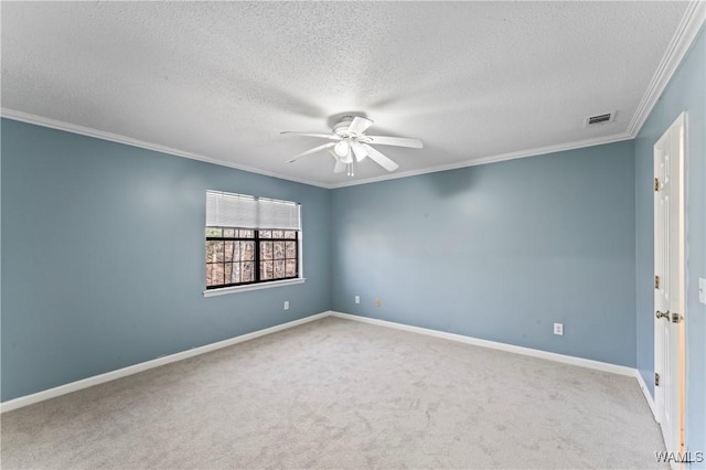 carpeted empty room with ornamental molding, a textured ceiling, and ceiling fan