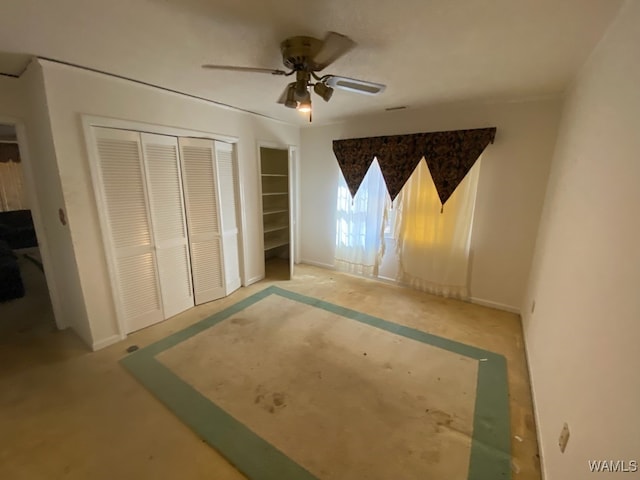 unfurnished bedroom featuring ceiling fan