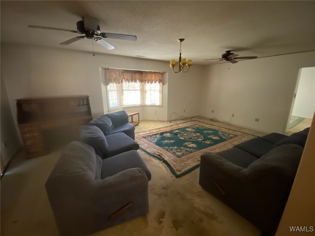 living area featuring a textured ceiling and ceiling fan with notable chandelier