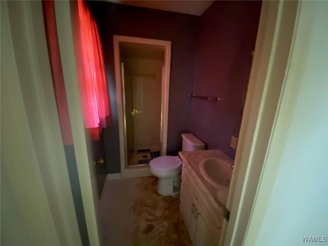 full bath with toilet, a stall shower, and vanity