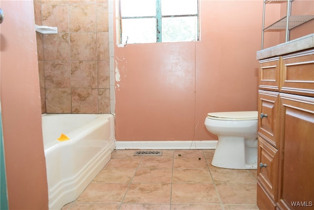 bathroom with tile patterned floors, shower / bath combination, and toilet