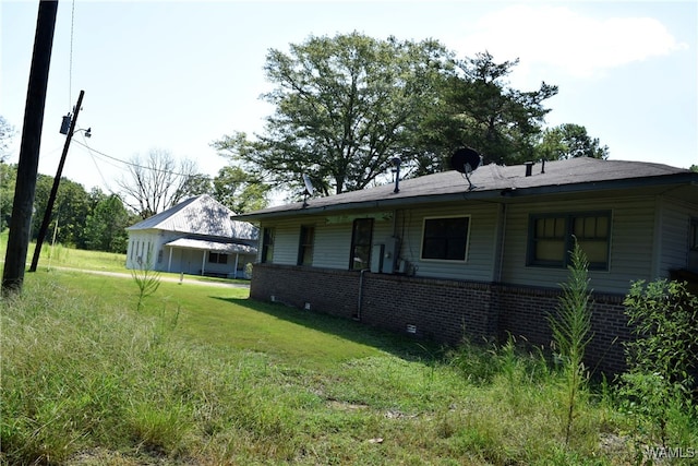 view of property exterior with a lawn