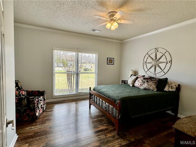 bedroom featuring ceiling fan, a textured ceiling, visible vents, dark wood-style floors, and crown molding