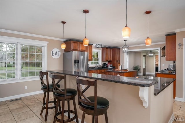 12280 Viewpoint Rd, Northport, AL 35475 - kitchen featuring crown molding, visible vents, a sink, and stainless steel fridge with ice dispenser