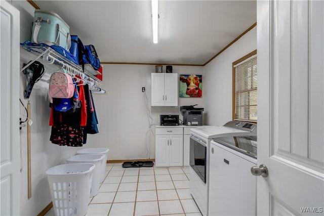 12280 Viewpoint Rd, Northport, AL 35475 - clothes washing area with light tile patterned flooring, washing machine and dryer, baseboards, cabinet space, and crown molding