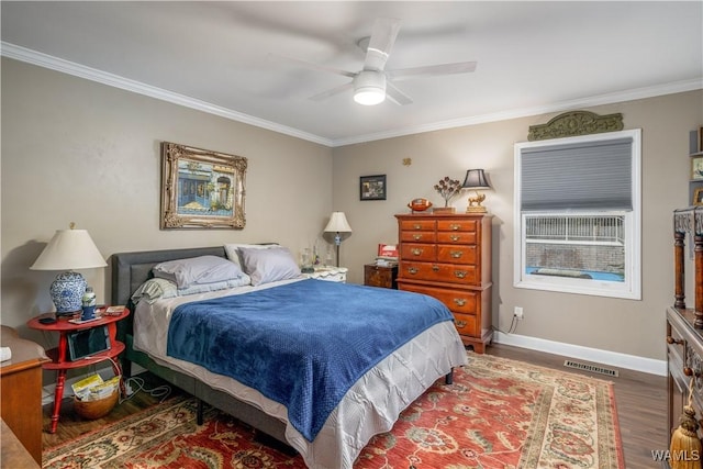 12280 Viewpoint Rd, Northport, AL 35475 - bedroom with wood finished floors, a ceiling fan, visible vents, baseboards, and crown molding