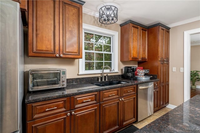 12280 Viewpoint Rd, Northport, AL 35475 - kitchen featuring a toaster, dark stone counters, stainless steel appliances, crown molding, and a sink