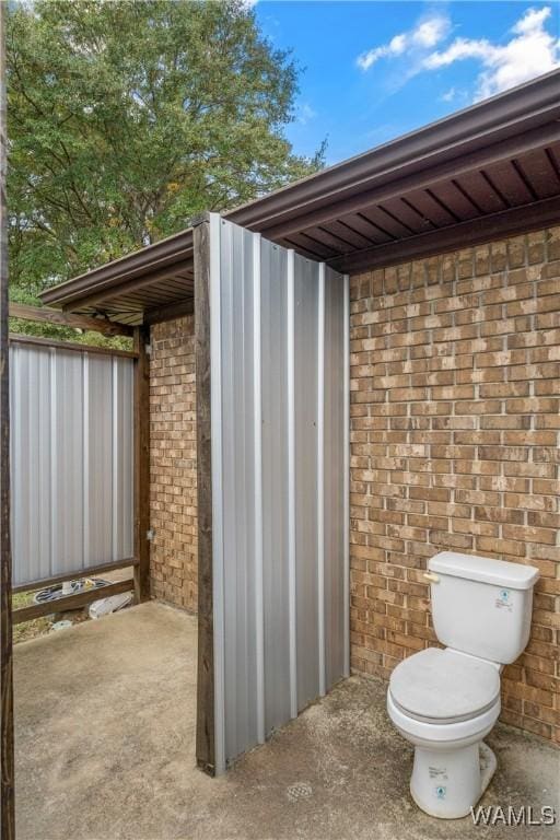 12280 Viewpoint Rd, Northport, AL 35475 - bathroom featuring toilet and brick wall