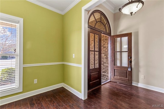 entryway featuring ornamental molding and dark hardwood / wood-style floors