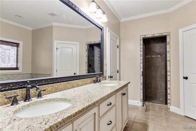 bathroom featuring vanity, tile patterned flooring, a shower with shower door, and ornamental molding