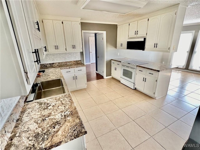 kitchen featuring white cabinets, sink, white electric stove, ornamental molding, and light tile patterned floors