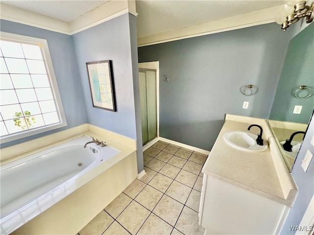 bathroom with shower with separate bathtub, vanity, and tile patterned floors