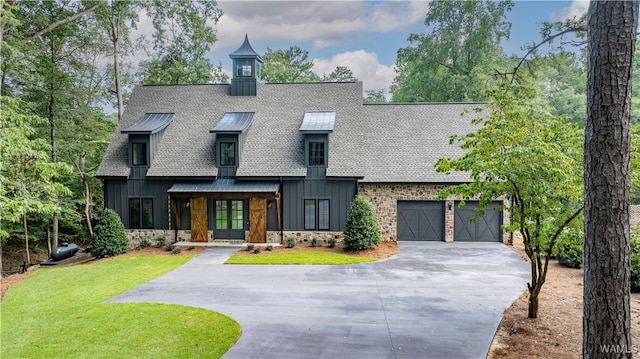 view of front of house featuring a garage and a front lawn