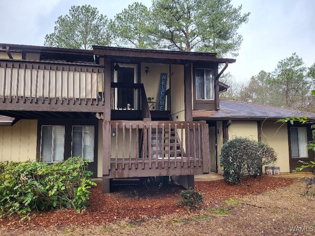 rear view of house featuring a balcony