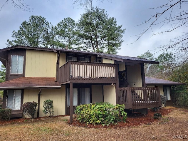 back of property featuring a balcony