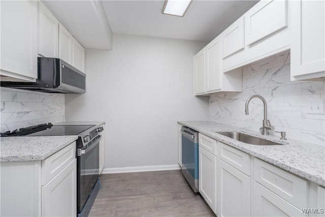 1721 Hackberry Ln Unit 6, Tuscaloosa, AL 35401 - kitchen with electric range oven, a sink, dishwasher, and backsplash