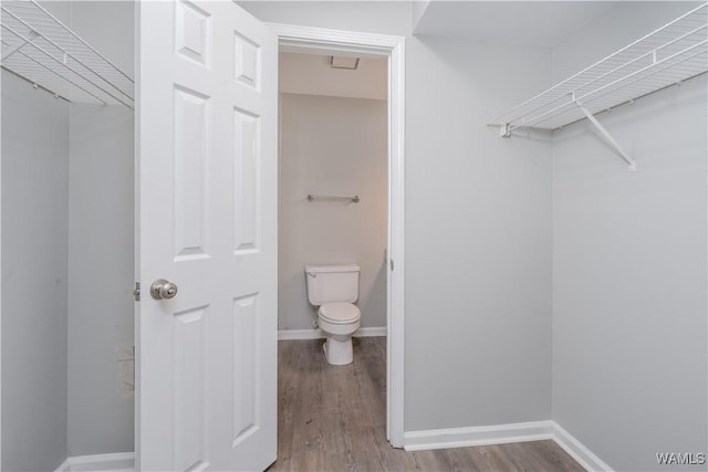 1721 Hackberry Ln Unit 6, Tuscaloosa, AL 35401 - bathroom with toilet, wood finished floors, and baseboards