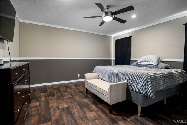 bedroom featuring ceiling fan, baseboards, ornamental molding, dark wood-style floors, and a textured ceiling