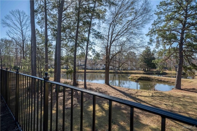 property view of water featuring fence