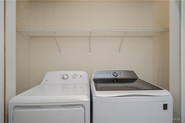 washroom featuring laundry area and independent washer and dryer