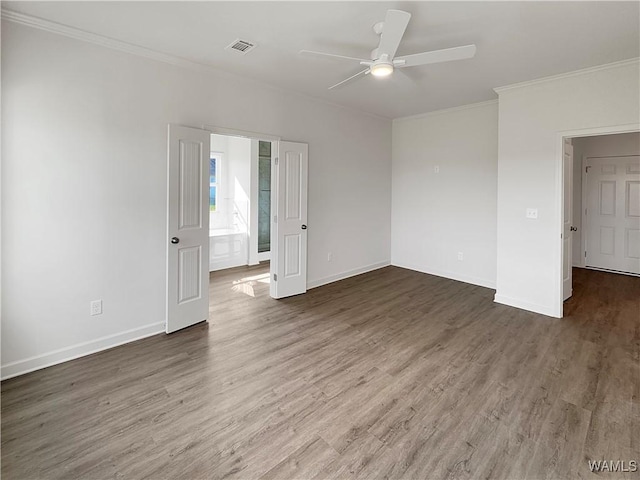 spare room featuring ornamental molding, ceiling fan, and dark hardwood / wood-style flooring