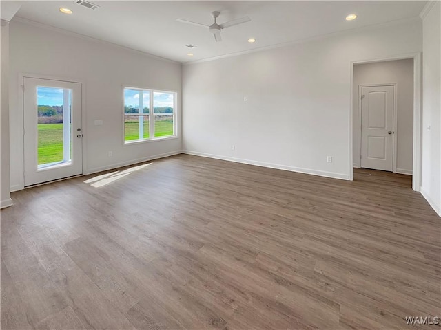 spare room with hardwood / wood-style flooring, ceiling fan, and ornamental molding