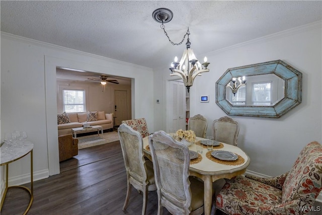 3216 34th Ave, Northport, AL 35476 - dining area with a chandelier, ornamental molding, dark wood-type flooring, and a textured ceiling
