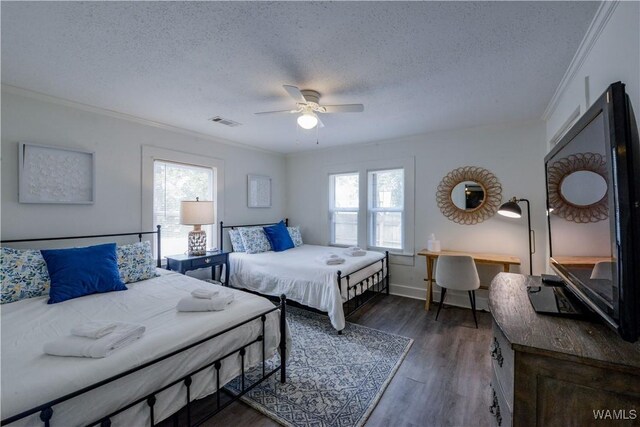 3216 34th Ave, Northport, AL 35476 - bedroom with a textured ceiling, ornamental molding, wood finished floors, baseboards, and ceiling fan