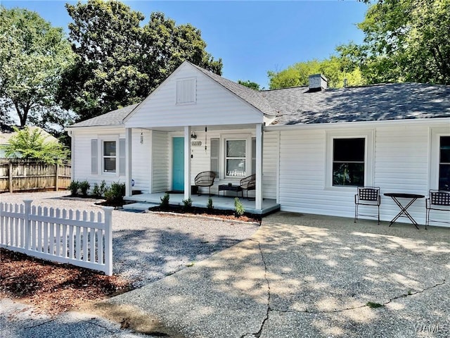 3216 34th Ave, Northport, AL 35476 - bungalow featuring covered porch, a chimney, and a shingled roof